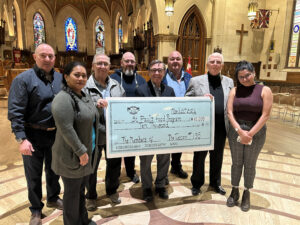 Members of Tuscan Lodge No. 195 pose inside a cathedral during a $10,000 cheque presentation to St. Paul’s Food Program in London Ontario