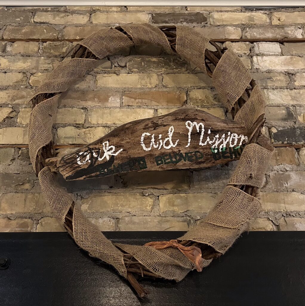 Decorative wreath displayed inside Ark Aid Mission facility, symbolizing hope, compassion, and community support for individuals experiencing homelessness.