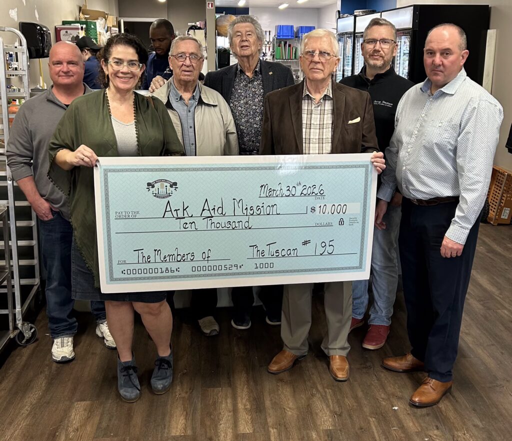 Members of Tuscan Lodge No.195 posing with a donation cheque presented to Ark Aid Mission, highlighting their support for community outreach and assistance programs.