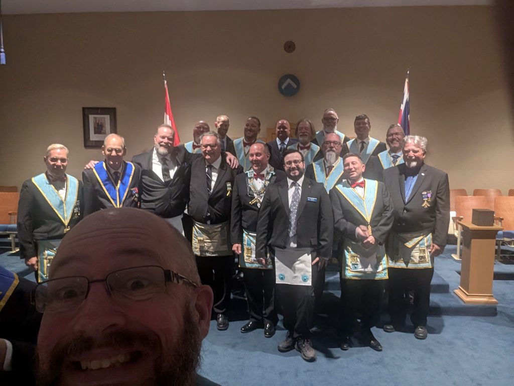 The Tuscan’s “Everywhere Mike” photobombs the group photo following the Second Degree meeting.
